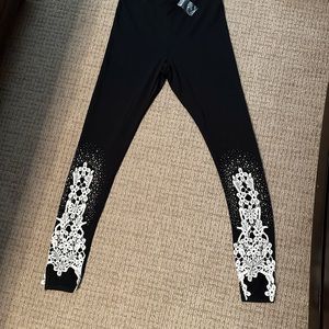 Brand new black leggings with lace stitching on the legs